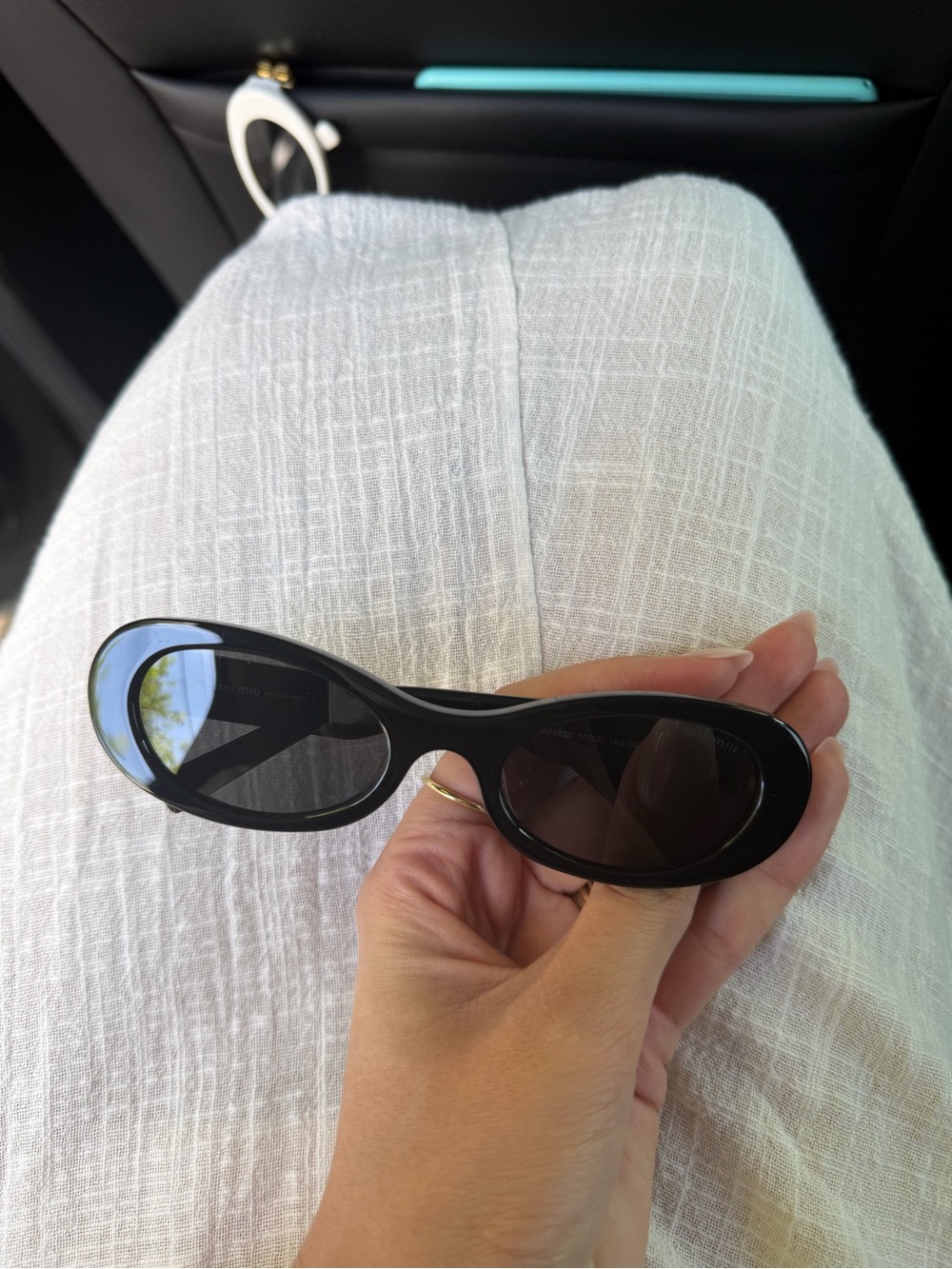 Miu Miu Black Oval Sunglasses